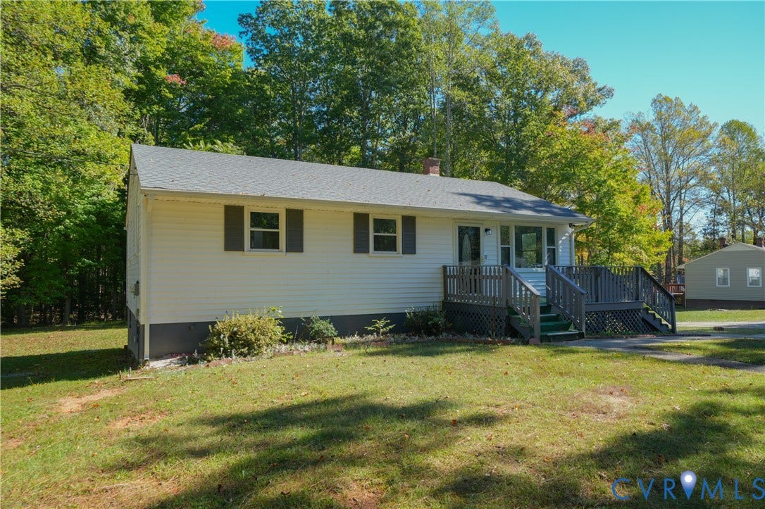 3622 New Bethel Road, Meherrin, VA 23954 Single-story exterior featuring light-colored siding, a gabled roofline, and an elevated wood deck entry