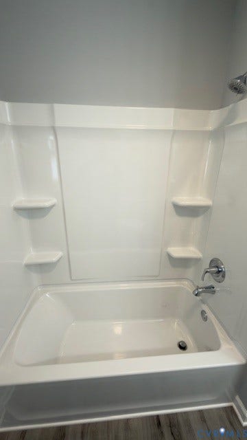 510 Old Town Drive, Ellerslie, Colonial Heights, VA 23834 Bathtub with a white acrylic surround, built-in shelving, chrome faucet hardware, and a fixed shower head