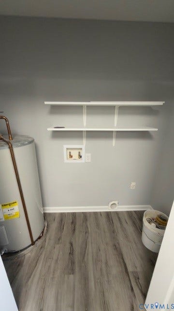 510 Old Town Drive, Ellerslie, Colonial Heights, VA 23834 Utility space featuring wood-finish flooring, two wall-mounted white shelves, and water heater