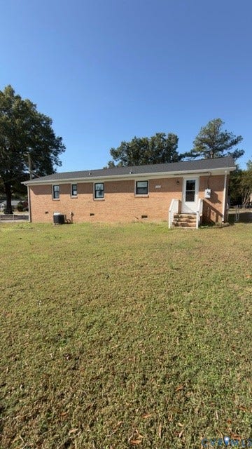 510 Old Town Drive, Ellerslie, Colonial Heights, VA 23834 Brick exterior residence featuring a dark shingle roof, multi-pane windows, and a raised wooden staircase entry