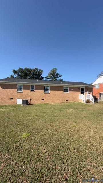 510 Old Town Drive, Ellerslie, Colonial Heights, VA 23834 Brick exterior, dark shingle roof, white stair railings, and grass-covered backyard