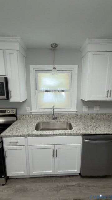 510 Old Town Drive, Ellerslie, Colonial Heights, VA 23834 Kitchen featuring white shaker cabinetry, stone-surface countertops, stainless steel undermount sink with gooseneck faucet, brushed-nickel hardware, and pendant lighting