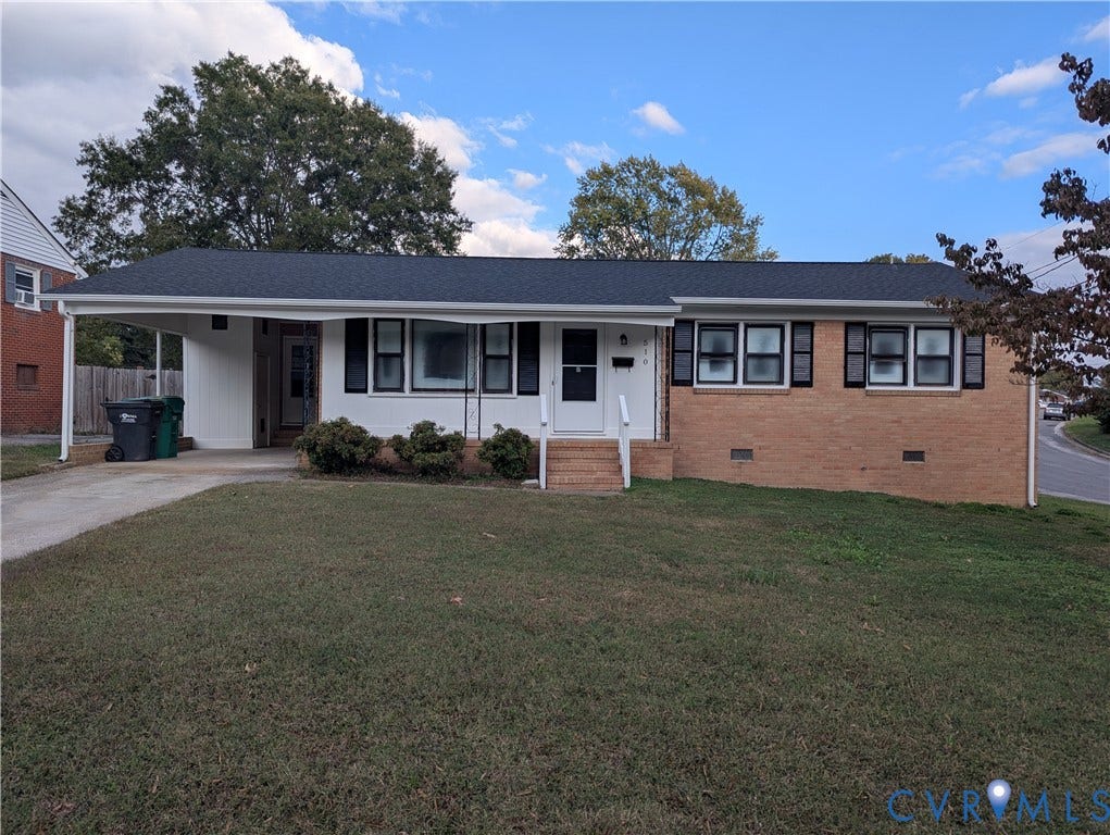 510 Old Town Drive, Ellerslie, Colonial Heights, VA 23834 Single-story residence featuring a combination brick and siding exterior, an attached carport, dark window shutters, and a shingled roof