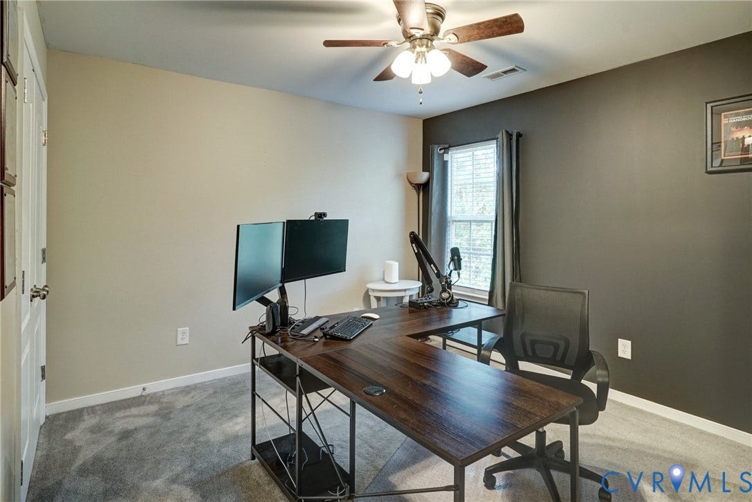 8909 Hollycroft Court, Mechanicsville, VA 23116 Room featuring neutral wall tones, a dark accent wall, plush carpeting, and a multi-blade ceiling fan with integrated lighting