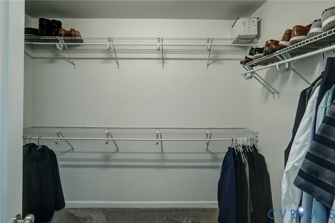 8909 Hollycroft Court, Mechanicsville, VA 23116 Walk-in closet featuring multi-tiered white wire shelving and integrated garment rods