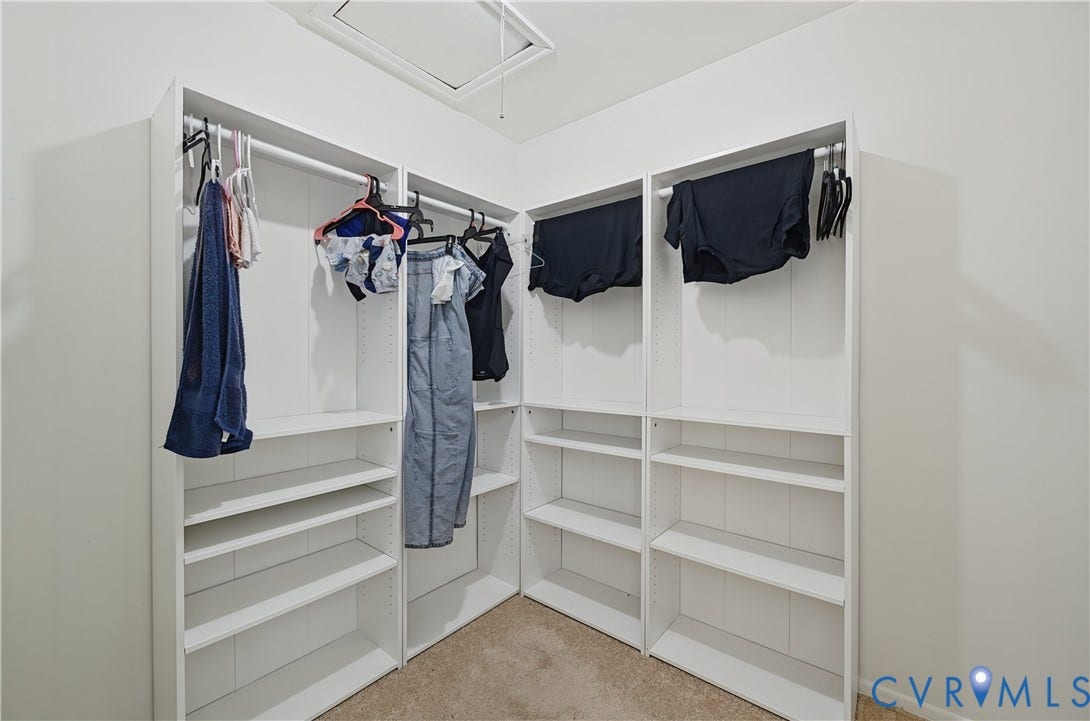 1101 Arch Hill Drive, Chesterfield, VA 23236 Walk-in closet featuring white built-in shelving units and integrated hanging rods