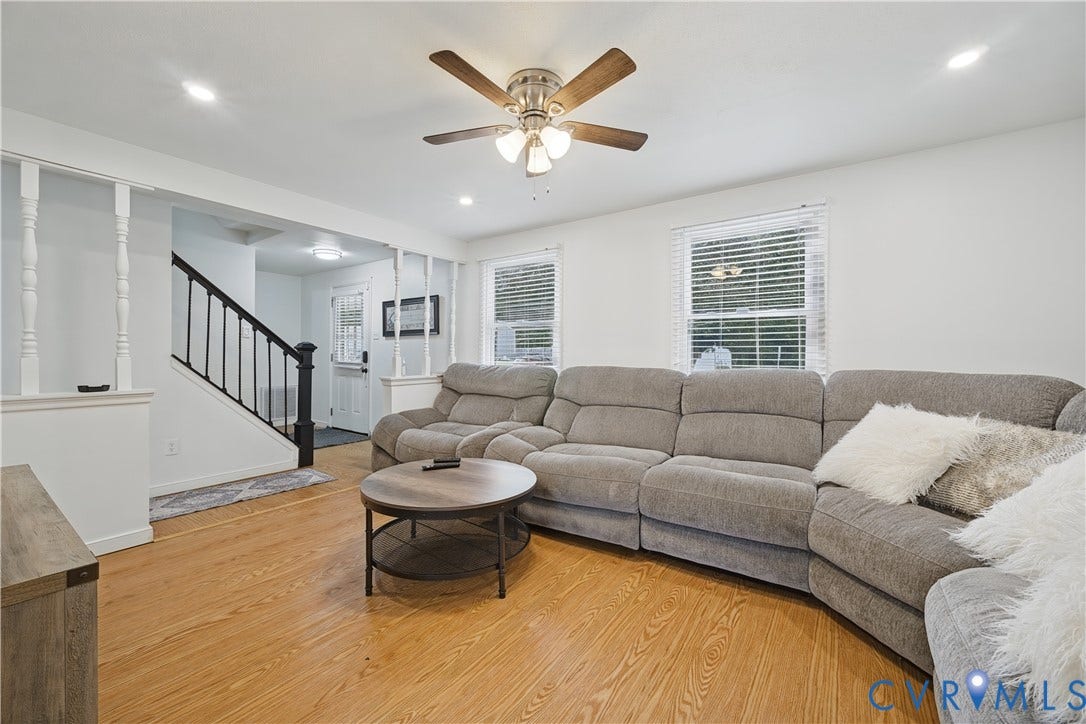 1101 Arch Hill Drive, Chesterfield, VA 23236 Wood-finish flooring, staircase with metal balusters, ceiling-mounted light fixture, recessed lighting, and horizontal window blinds