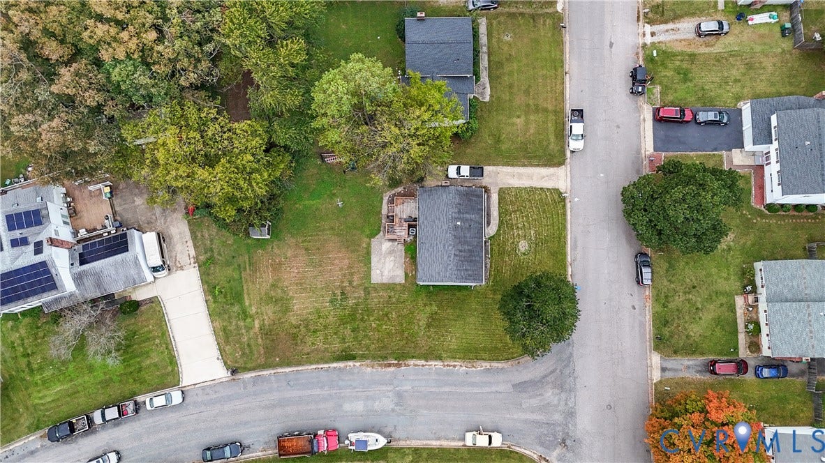 1101 Arch Hill Drive, Chesterfield, VA 23236 Aerial perspective of a property featuring a rectangular lot, mature canopy trees, an asphalt-paved driveway, and a rear patio area