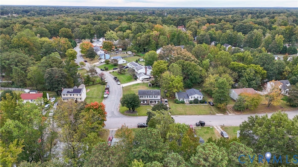 1101 Arch Hill Drive, Chesterfield, VA 23236 Aerial perspective of a residential neighborhood featuring mature canopy trees, established lawn landscapes, and winding paved streets