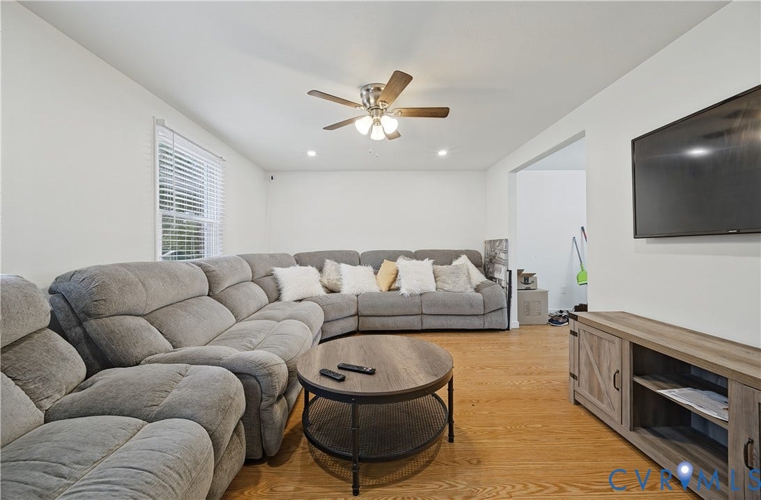1101 Arch Hill Drive, Chesterfield, VA 23236 Living area featuring wood-finish flooring, a ceiling fan with integrated lighting, and recessed ceiling lights