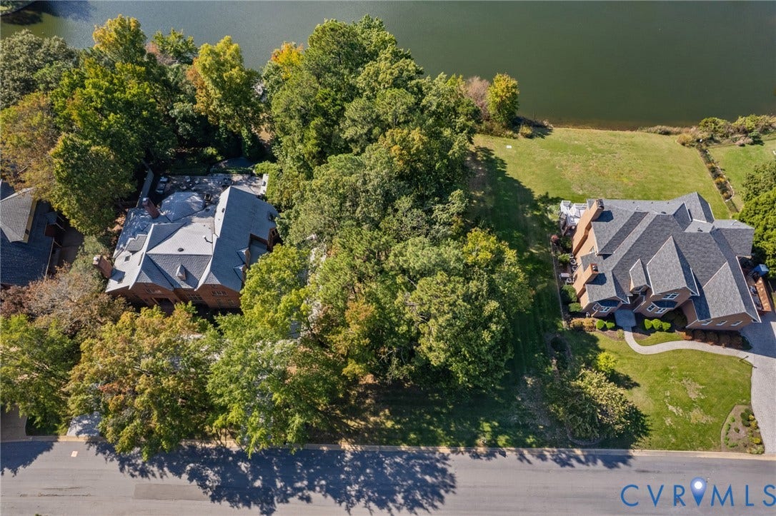 11433 Barrington Bridge Court, Henrico, VA 23233 Aerial perspective of waterfront properties featuring extensive wooded buffers, multi-gabled rooflines, and paved driveways
