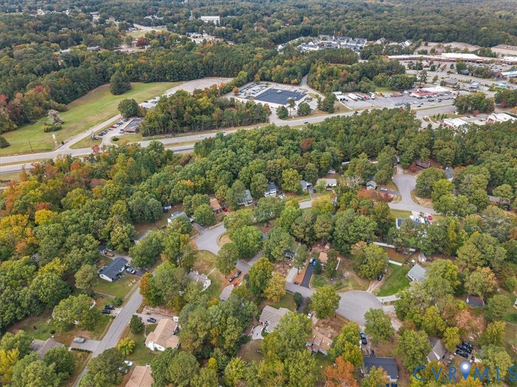 11518 Frederick Farms Circle, Midlothian, VA 23112 Aerial perspective of a residential neighborhood featuring mature canopy trees, winding paved streets, and expansive green space