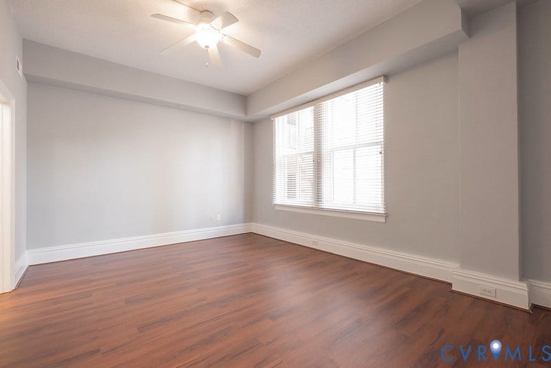 6 N 6th Street, #U3C, Downtown, Richmond, VA 23219 Interior room featuring wood-finish flooring, recessed ceiling lighting with an integrated fan, neutral wall paint, and windows fitted with horizontal blinds