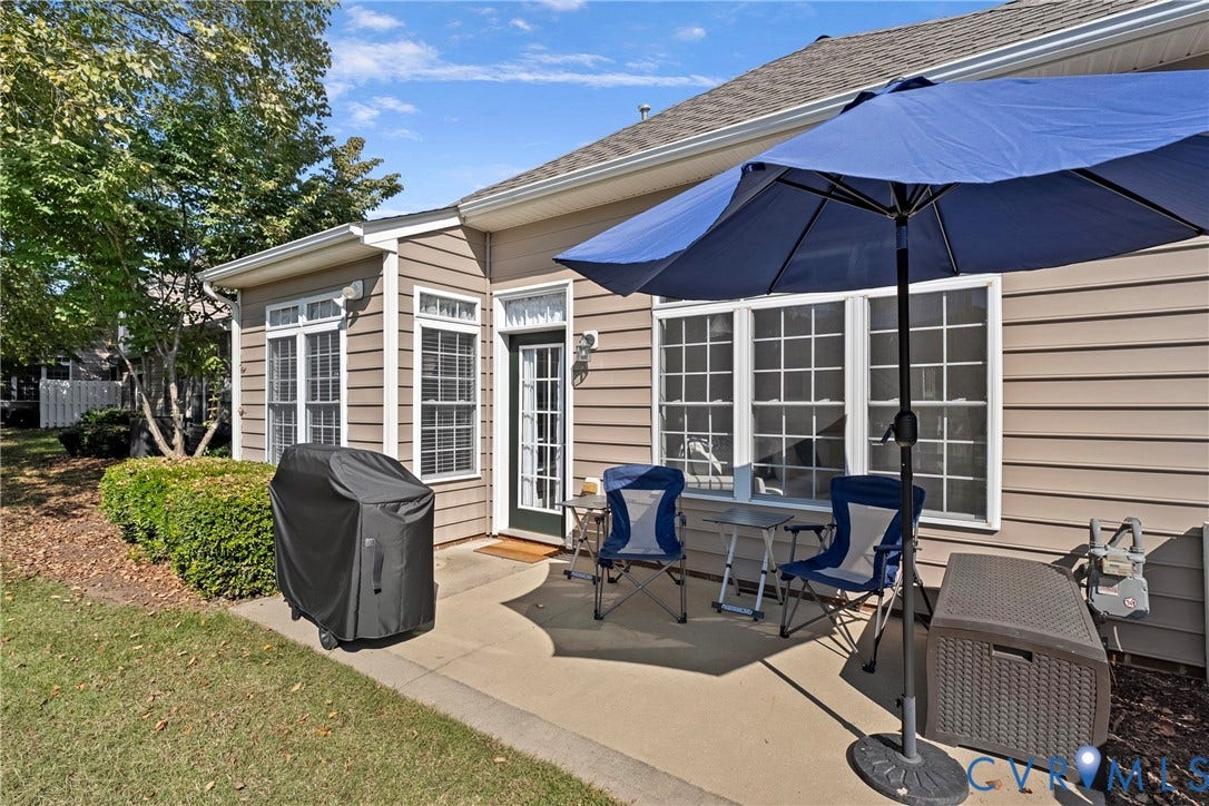 4914 Terrace Arbor Circle, Midlothian, VA 23112 Concrete patio featuring horizontal vinyl siding, multi-pane windows, and a glass-paneled exterior door
