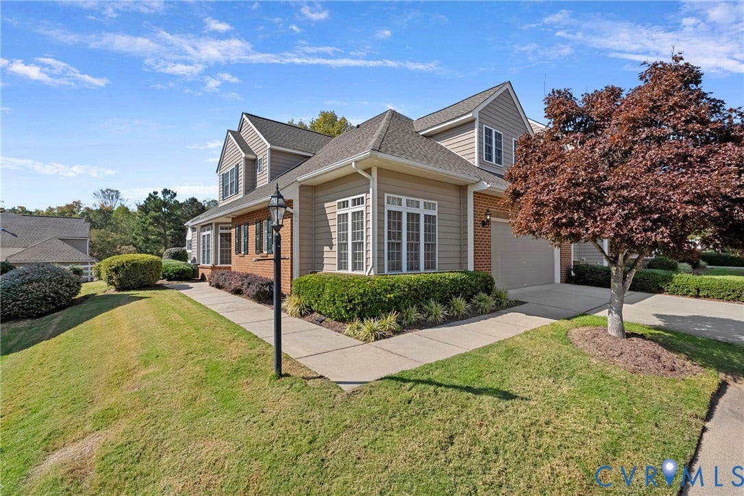 4914 Terrace Arbor Circle, Midlothian, VA 23112 Multi-level exterior, brick masonry detailing, multi-gabled roofline, multi-pane windows, and a concrete driveway