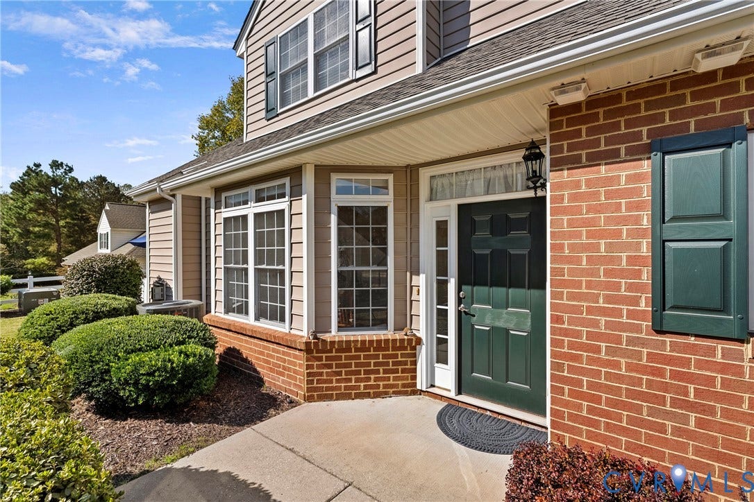 4914 Terrace Arbor Circle, Midlothian, VA 23112 Exterior featuring a covered entry with a dark green paneled door, multi-pane windows with decorative shutters.