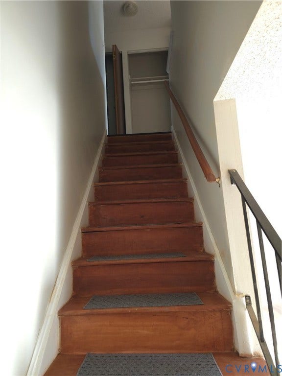 413 Adamson Street, Henrico, VA 23075 Staircase featuring wood-finish treads and a metal handrail