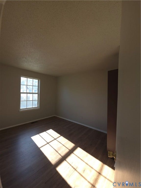 413 Adamson Street, Henrico, VA 23075 Interior space featuring wood-finish flooring, a single-hung window with a multi-pane grid, and neutral wall tones