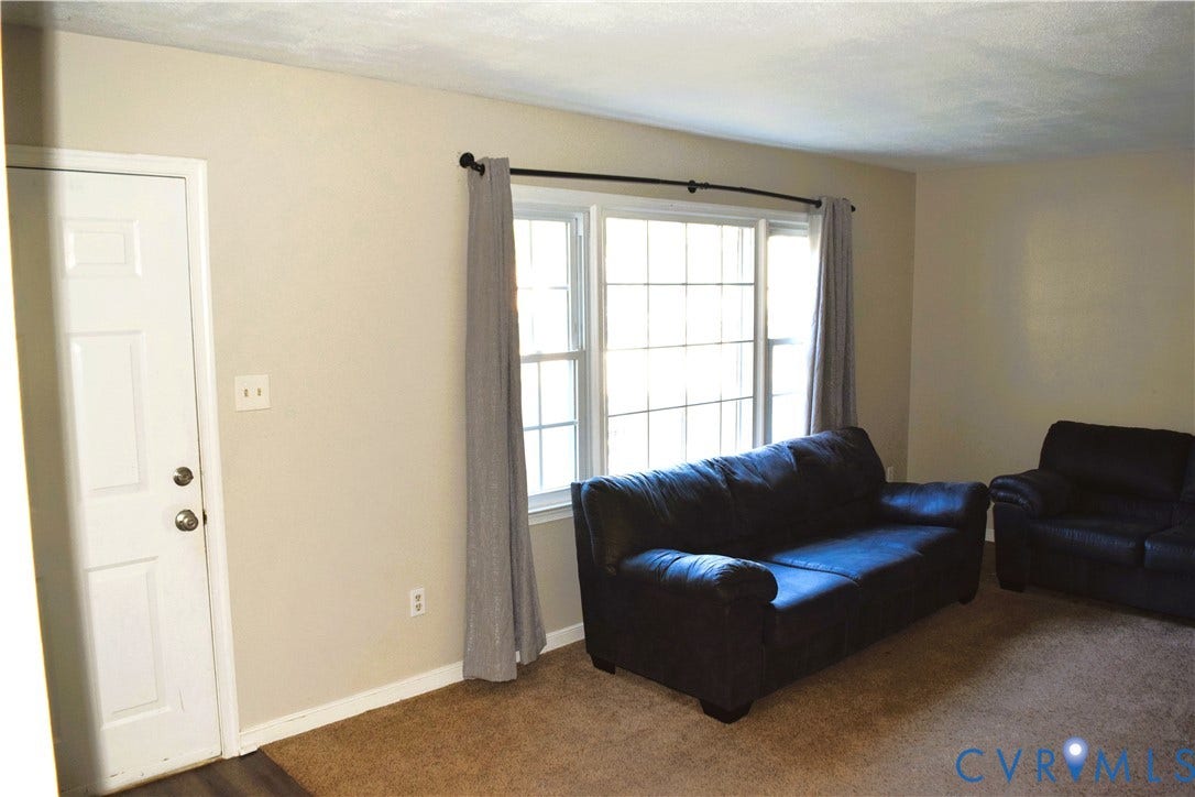 8905 Hawkbill Road, Chesterfield, VA 23237 Neutral wall tones, multi-pane window configuration, and six-panel interior door