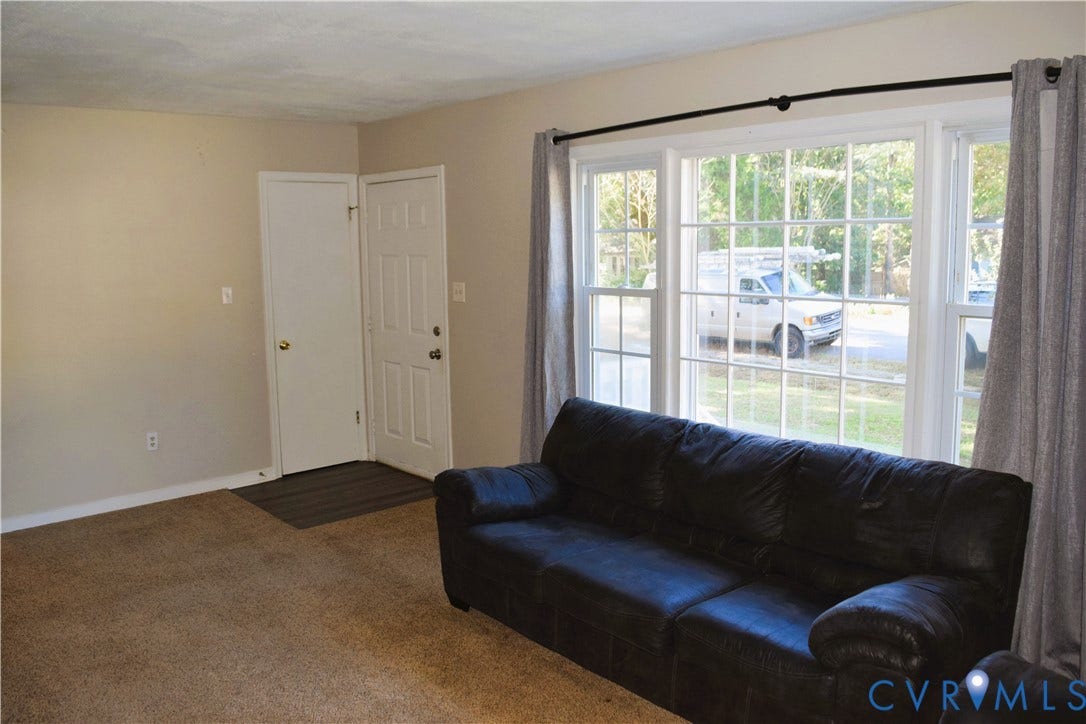 8905 Hawkbill Road, Chesterfield, VA 23237 Multi-pane windows, carpeted flooring, and a six-panel entry door