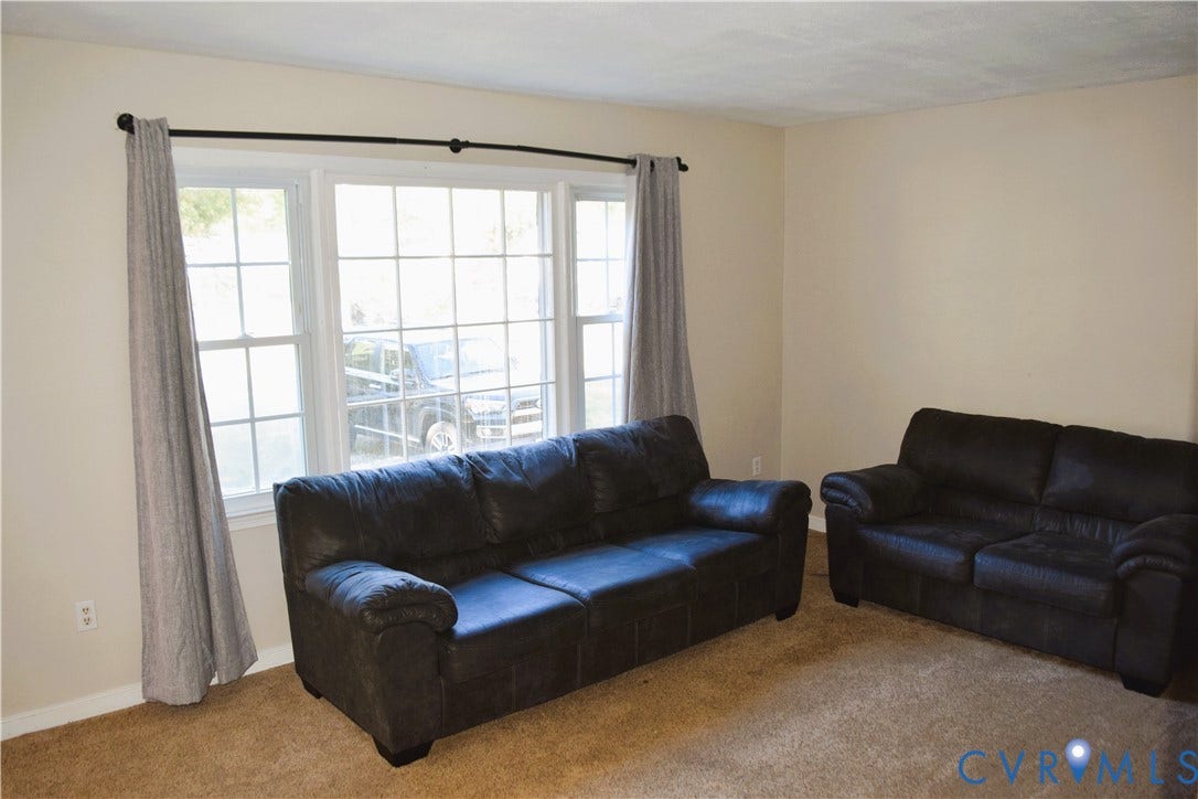 8905 Hawkbill Road, Chesterfield, VA 23237 Large multi-pane window with a center picture frame configuration, neutral wall coloring, and wall-to-wall carpeting