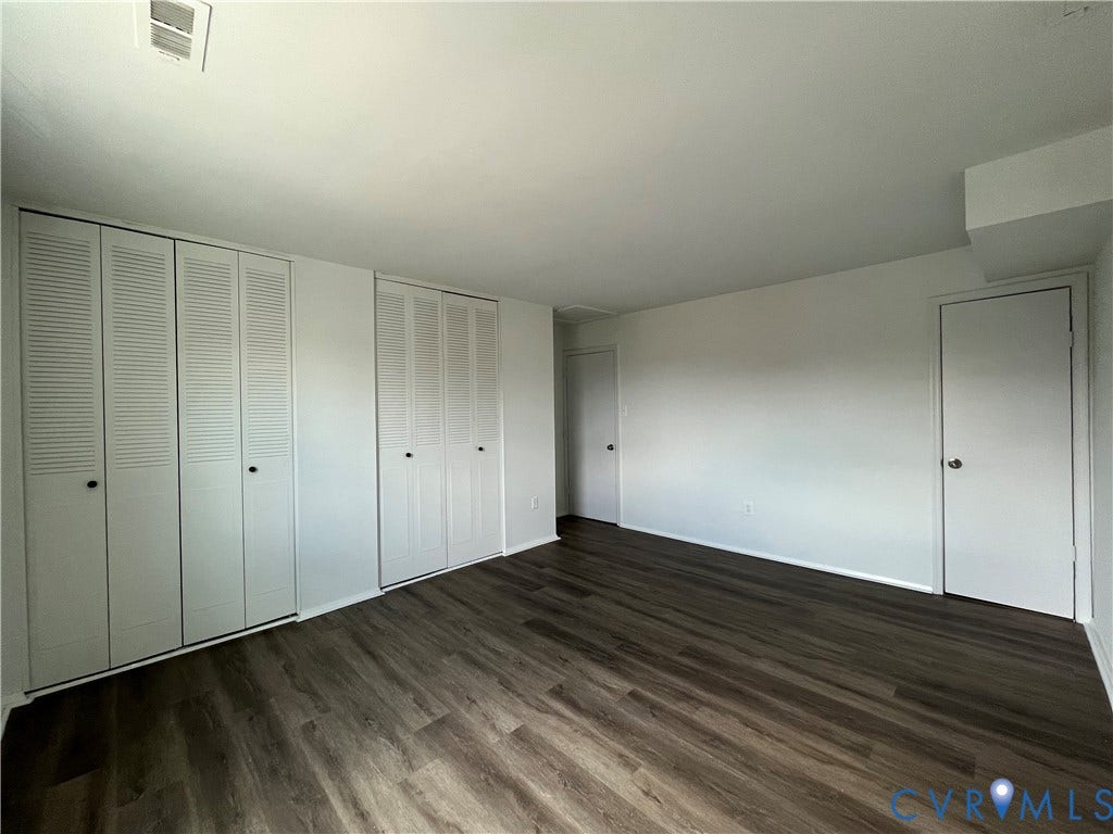 39 Rock Garden Lane, Henrico, VA 23228 Wood-finish flooring, dual sets of bi-fold closet doors, and neutral wall tones
