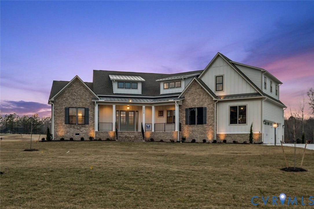 18132 Dogwood Trail Way, Rockville, VA 23146 Exterior facade featuring a combination of brick and board-and-batten siding, a covered front porch with metal roofing accents, and multi-gabled rooflines