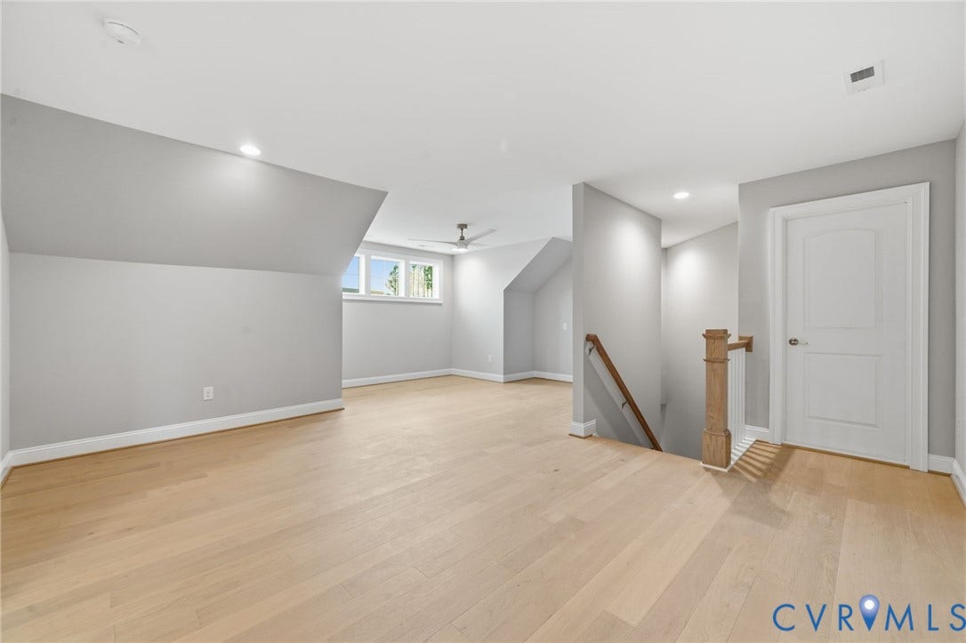 18132 Dogwood Trail Way, Rockville, VA 23146 Vaulted ceilings, wood-finish flooring, recessed lighting, ceiling fan, and staircase with wooden handrail