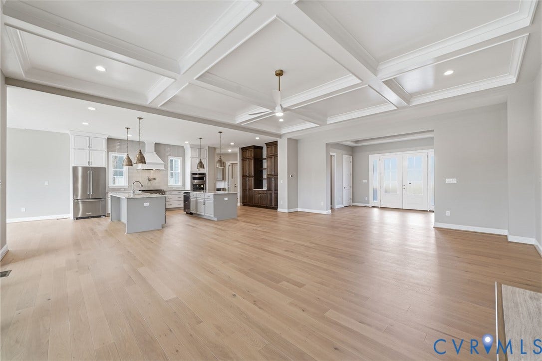 18132 Dogwood Trail Way, Rockville, VA 23146 Coffered ceiling featuring recessed lighting, wood-finish flooring, central island with quartz countertops, custom cabinetry, and double French doors