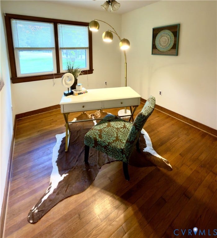 9012 Shawonodasee Road, Courthouse, Chesterfield, VA 23832 Room featuring wood-finish flooring, dark wood window trim, and a multi-light flush-mount ceiling fixture