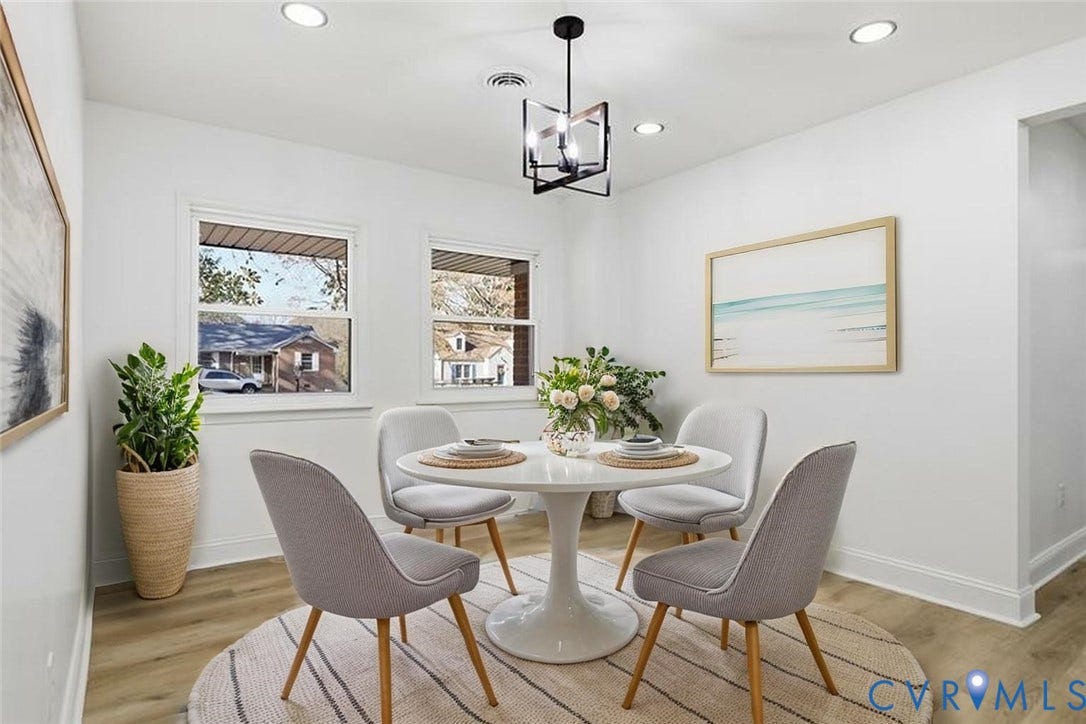 Wood-finish flooring, dual windows with exterior views, geometric-frame pendant lighting, and recessed ceiling lights
