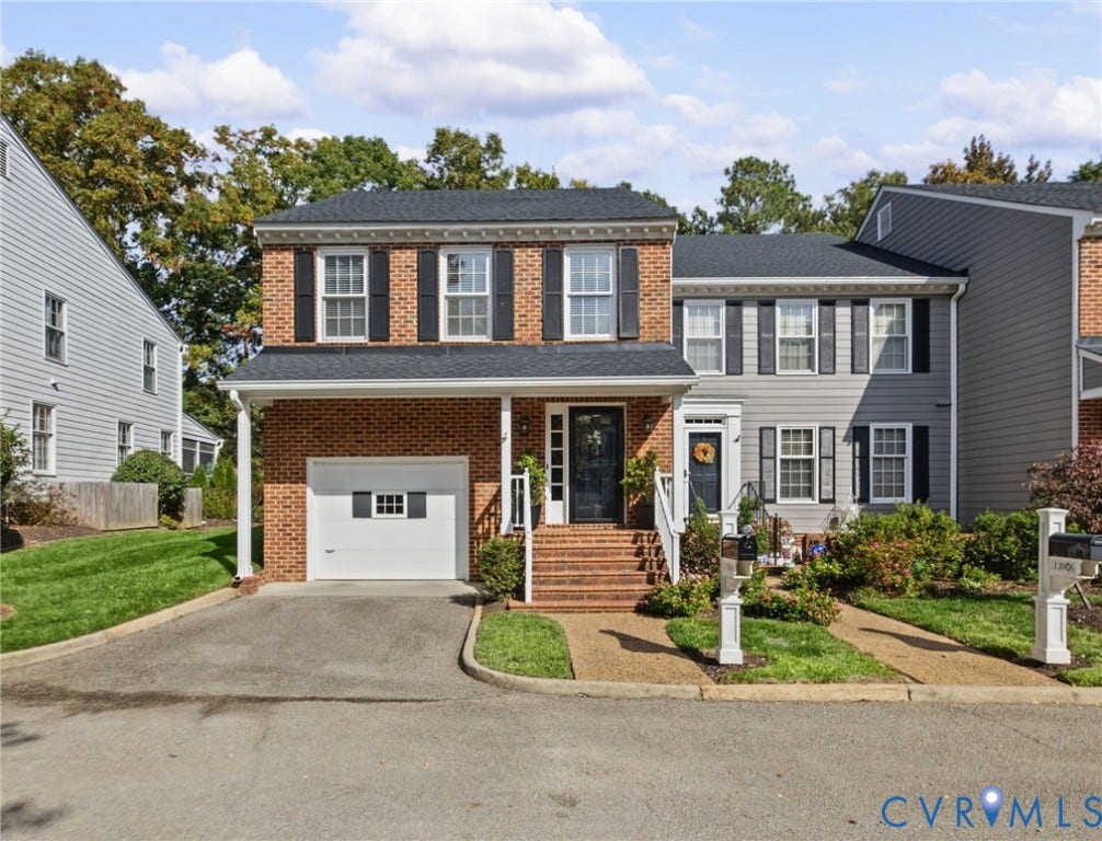 13908 Pagehurst Terrace, Salisbury, Midlothian, VA 23113 Traditional brick facade featuring decorative shutters, multi-pane windows, a single-car garage, and brick-stepped entryway