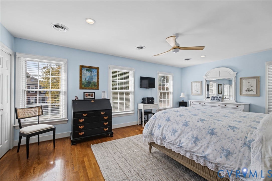 13908 Pagehurst Terrace, Salisbury, Midlothian, VA 23113 Spacious room featuring wood-finish flooring, recessed lighting, a modern ceiling fan, and multiple windows with horizontal blinds