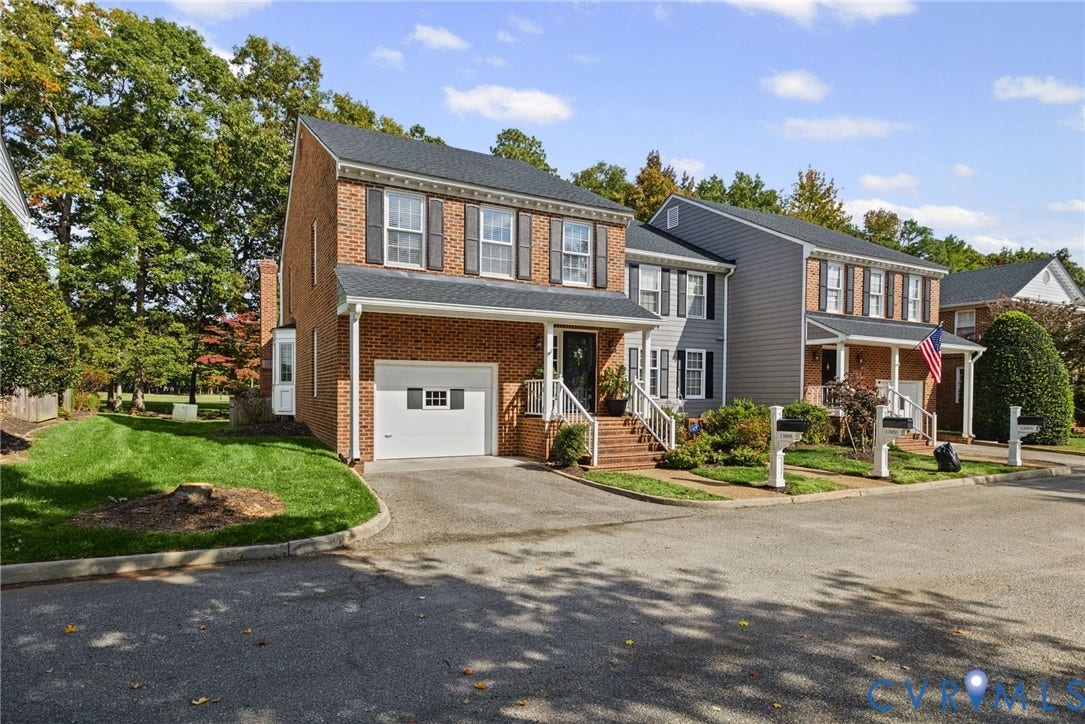 13908 Pagehurst Terrace, Salisbury, Midlothian, VA 23113 Two-story colonial exterior featuring a brick facade, asphalt shingle roof, attached single-car garage, covered front porch with railings, and multi-pane windows with shutters