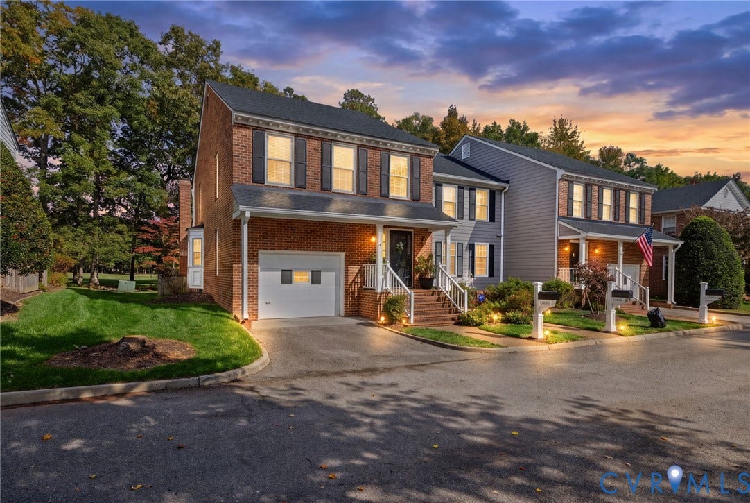 13908 Pagehurst Terrace, Salisbury, Midlothian, VA 23113 Two-story exterior featuring a brick facade with horizontal siding, an integrated single-car garage, shuttered windows, and a covered front entryway with stairs