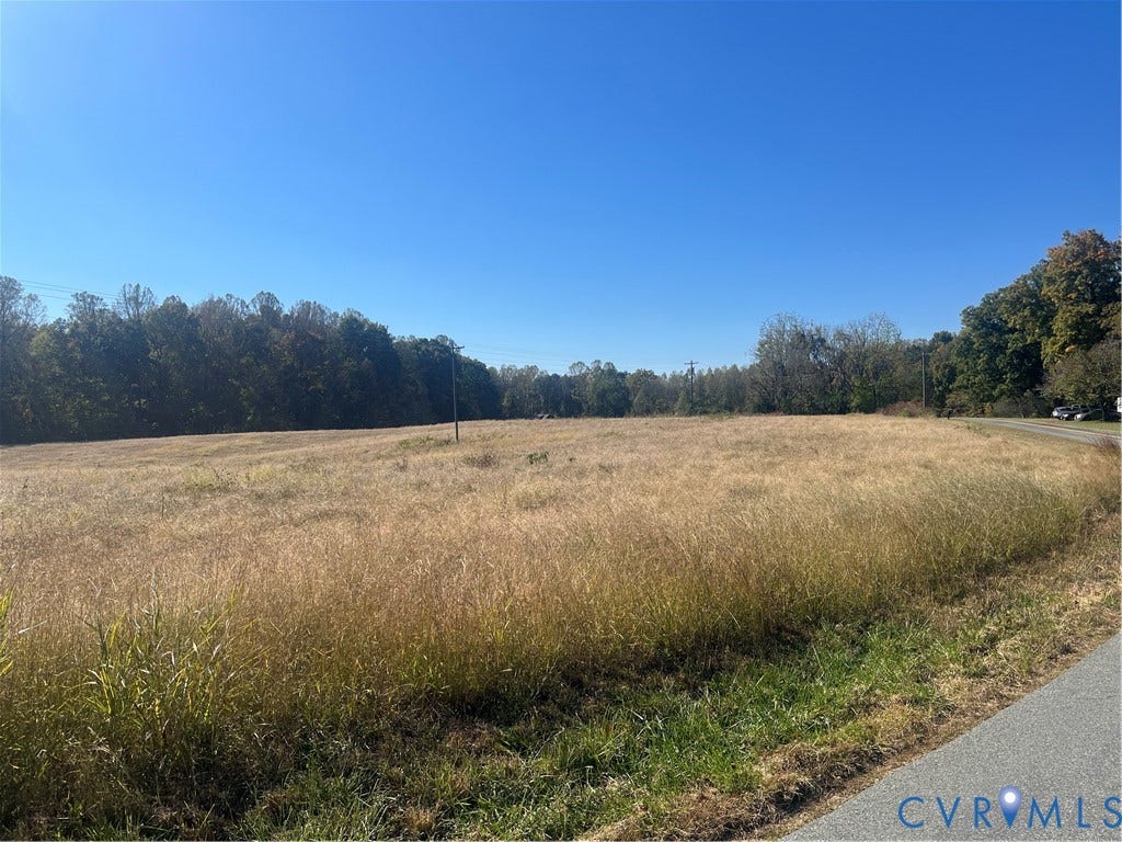 OOO Moody Town Road, Bumpass, Louisa, VA 23024 Expansive open lot featuring native grassland, mature tree borders, and paved road frontage