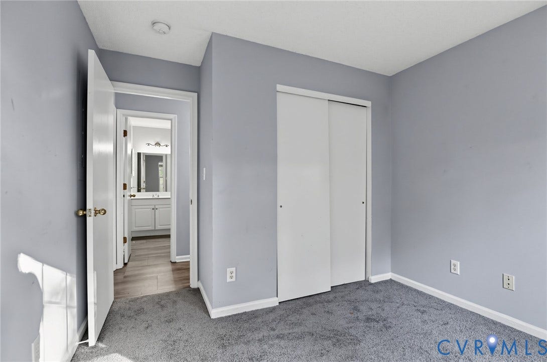 910 Rue Marseille, Les Chateaux, Chesapeake, VA 23320 Room featuring wall-to-wall carpeting, neutral interior paint, and a sliding-door closet