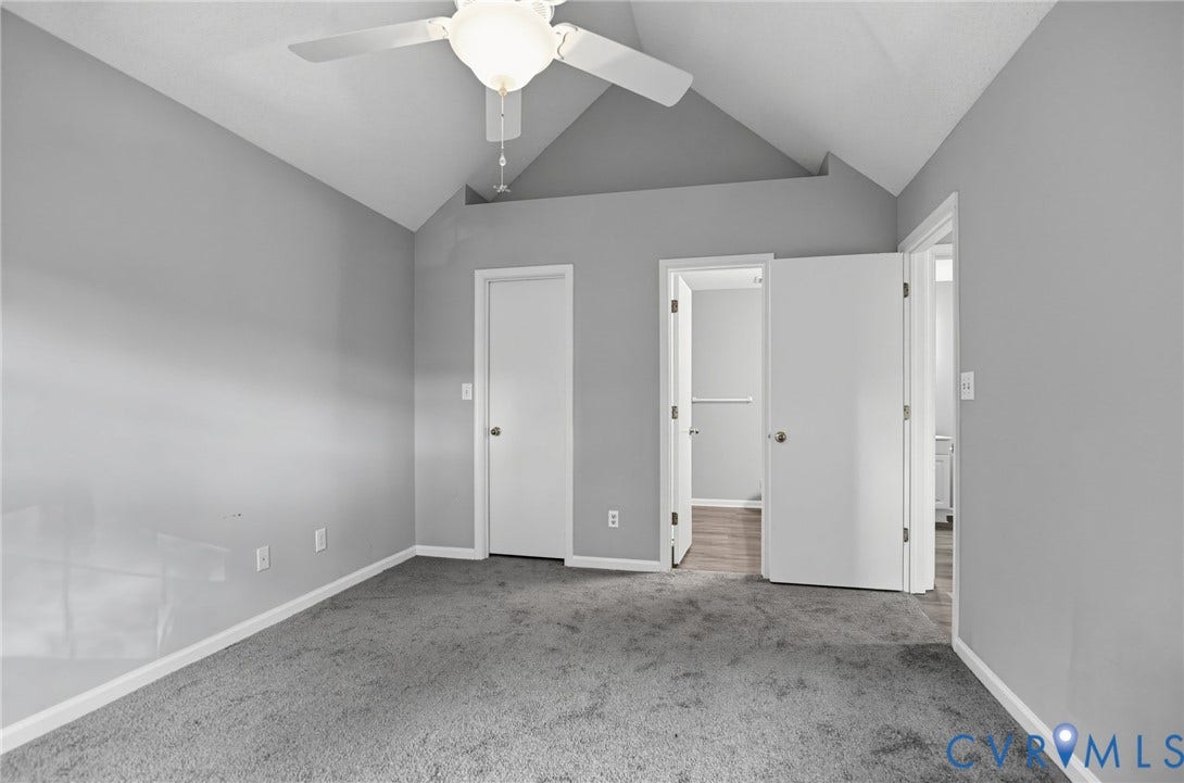 910 Rue Marseille, Les Chateaux, Chesapeake, VA 23320 Vaulted ceiling featuring a central white ceiling fan with integrated lighting, neutral wall finishes, and carpeted flooring