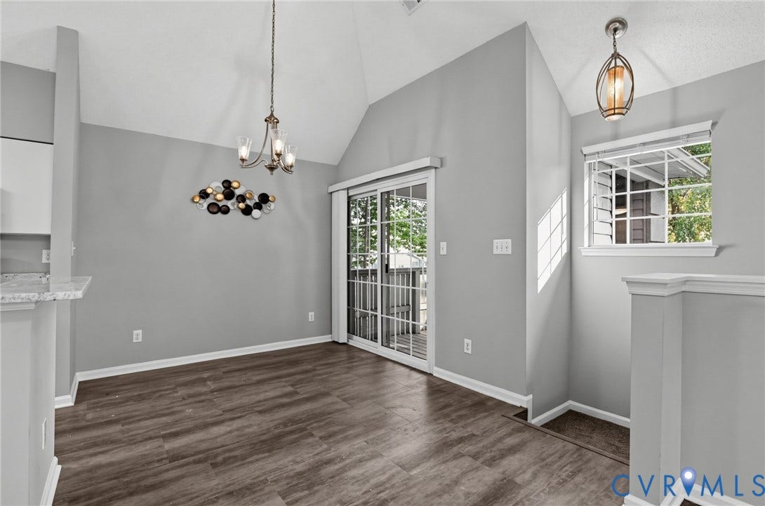 910 Rue Marseille, Les Chateaux, Chesapeake, VA 23320 Vaulted ceilings, wood-finish flooring, sliding glass door with external access, and dual pendant lighting fixtures