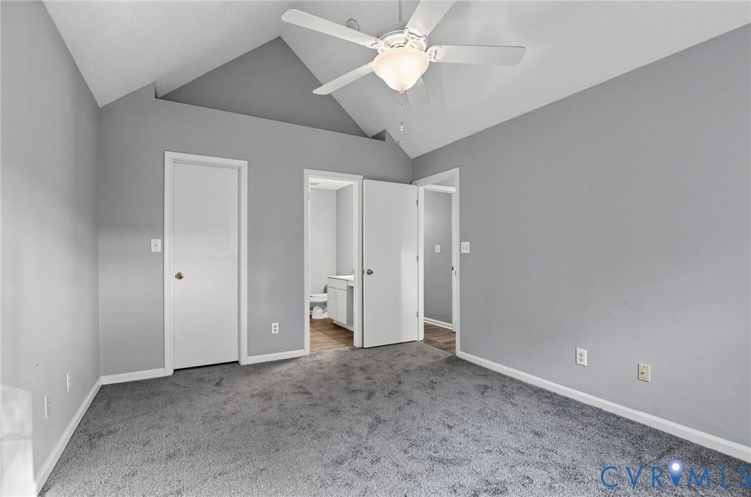 910 Rue Marseille, Les Chateaux, Chesapeake, VA 23320 Vaulted ceilings featuring a central white ceiling fan with integrated lighting, neutral wall paint, and wall-to-wall carpeting