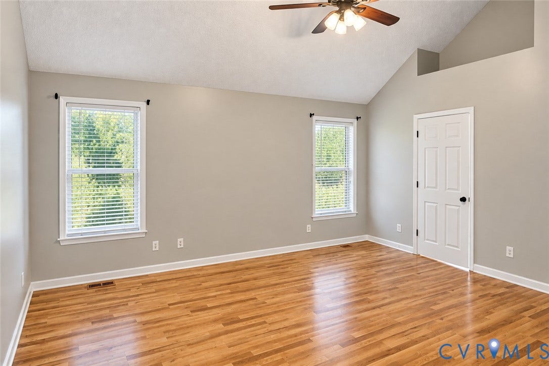 4229 Cedar Creek Lane, Prince George, VA 23875 Vaulted ceilings, wood-finish flooring, two dual-pane windows, and a ceiling-mounted light fixture