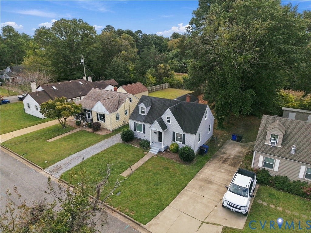 305 Arizona Street, Kingman Heights, Portsmouth, VA 23701 Cape Cod exterior featuring a gabled roofline, dormer windows, concrete driveway, and front lawn