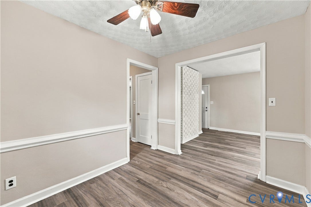 305 Arizona Street, Kingman Heights, Portsmouth, VA 23701 Interior featuring wood-finish flooring, white chair rail molding, a textured ceiling, and a ceiling-mounted light fixture with a fan