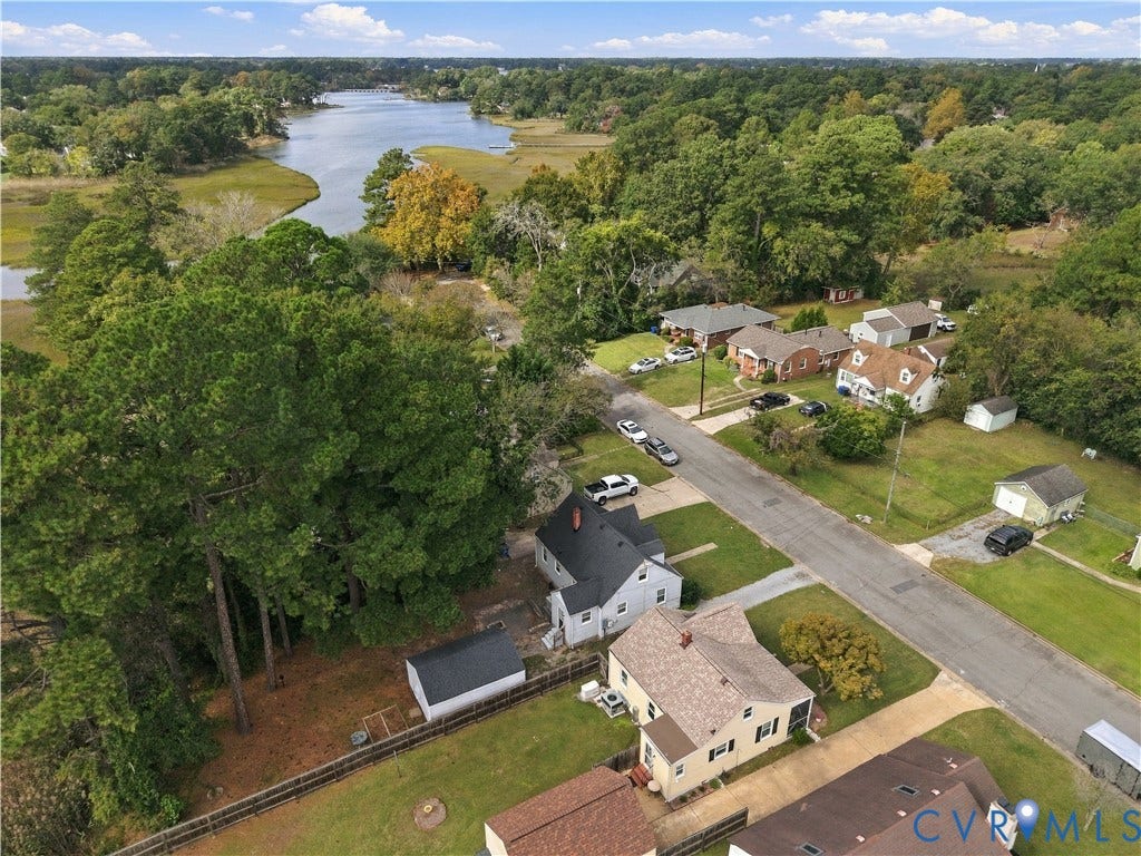 305 Arizona Street, Kingman Heights, Portsmouth, VA 23701 Aerial perspective featuring wooded surroundings, residential lots, asphalt street, and a proximity to tidal waterways