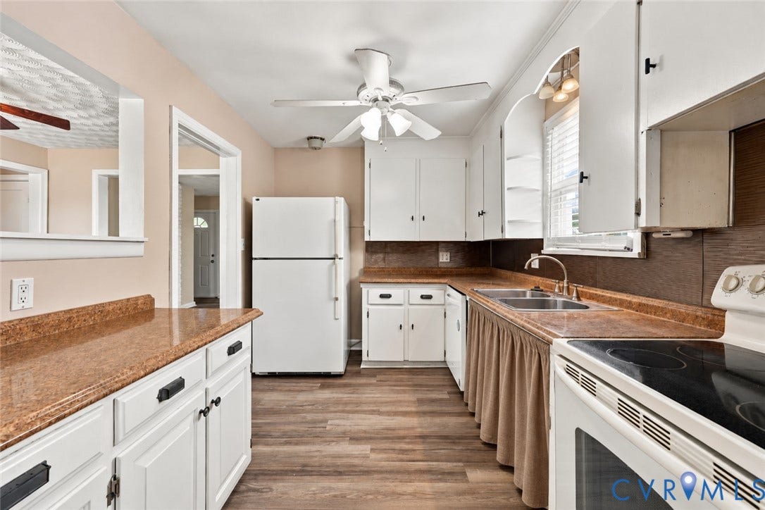 305 Arizona Street, Kingman Heights, Portsmouth, VA 23701 Kitchen featuring wood-finish flooring, white cabinetry, dark countertops, a double-basin sink, and a ceiling fan