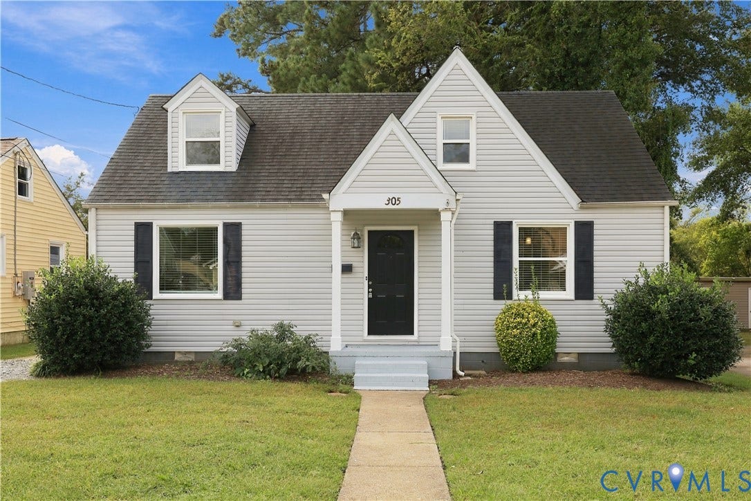 305 Arizona Street, Kingman Heights, Portsmouth, VA 23701 Cape Cod exterior featuring light gray horizontal siding, dark window shutters, a covered front entryway with columns, and a gabled roofline with dual dormers
