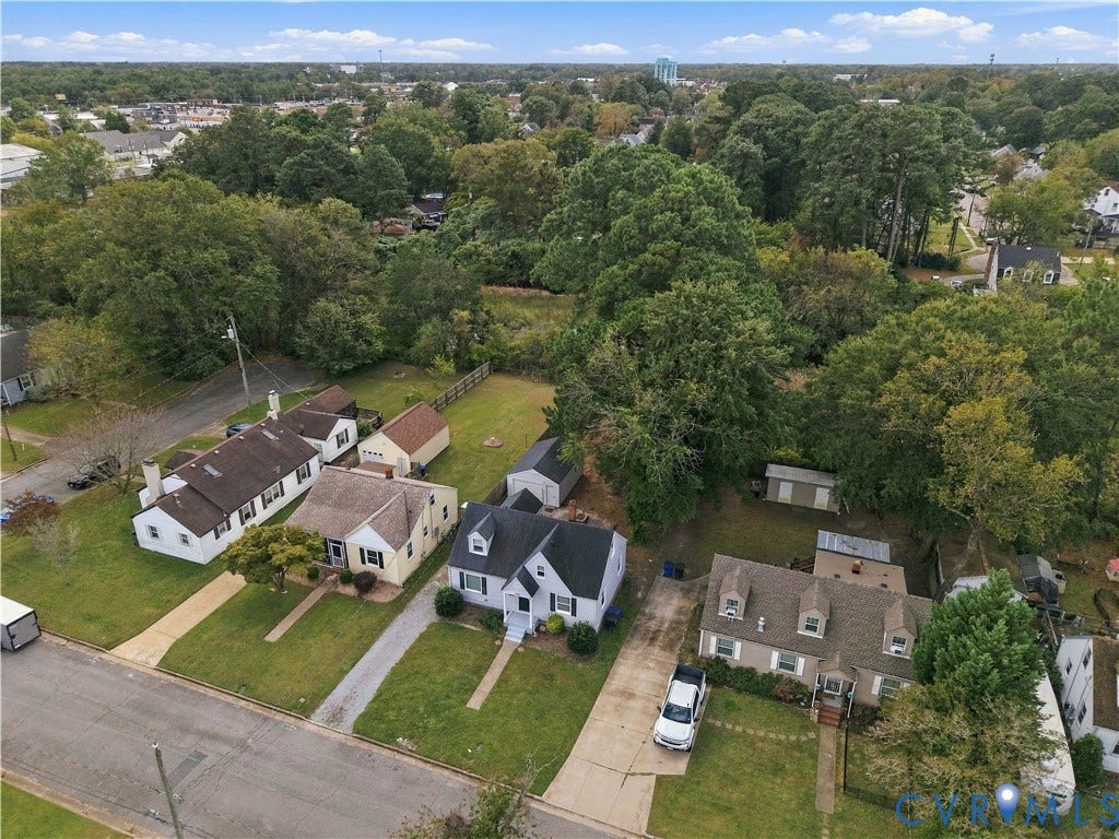 305 Arizona Street, Kingman Heights, Portsmouth, VA 23701 Aerial perspective of a residential lot featuring a detached storage structure, concrete driveway, and established tree canopy