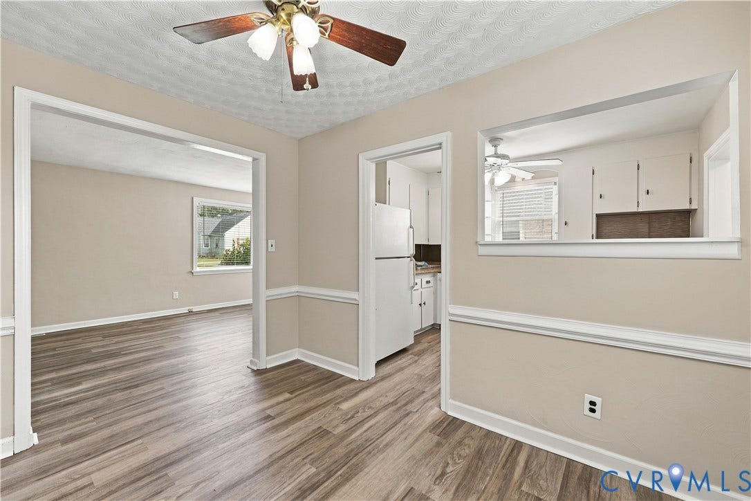 305 Arizona Street, Kingman Heights, Portsmouth, VA 23701 Interior space featuring wood-finish flooring, chair rail molding, and a ceiling-mounted light fixture with integrated fan
