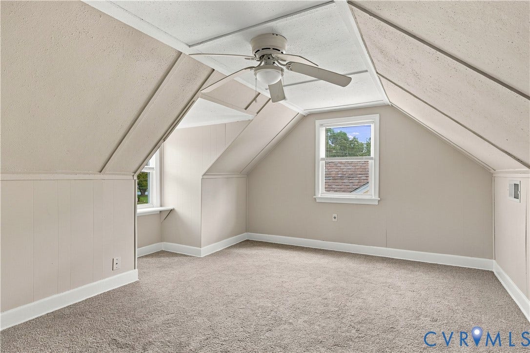 305 Arizona Street, Kingman Heights, Portsmouth, VA 23701 Attic space featuring slanted walls, dual windows, neutral carpeting, and a ceiling-mounted fan
