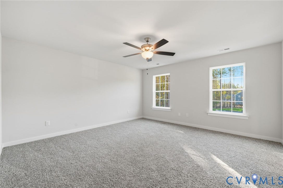 8209 Grantham Woods Way, Grantham Woods, Henrico, VA 23231 Neutral interior featuring wall-to-wall carpeting, dual windows, and a ceiling-mounted light fixture with fan blades